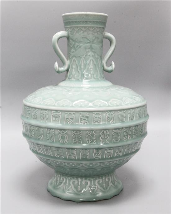 A large Chinese celadon glazed Hundred Shou vase